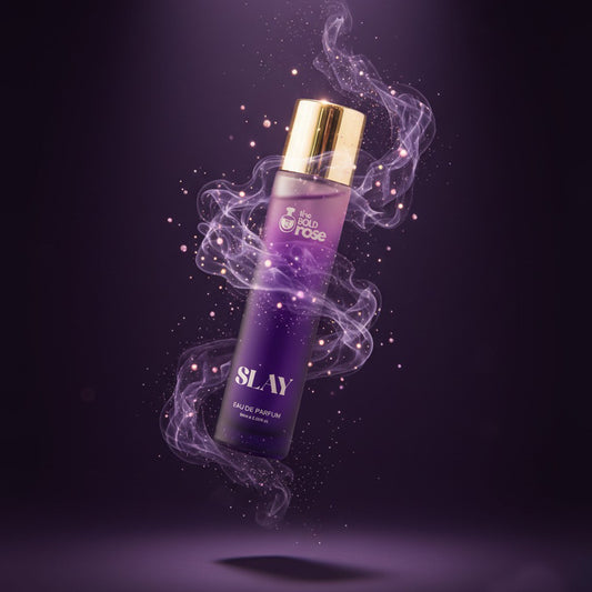 The Bold Rose Slay perfume bottle with purple smoke aura and luxe gold cap on a dark violet background.