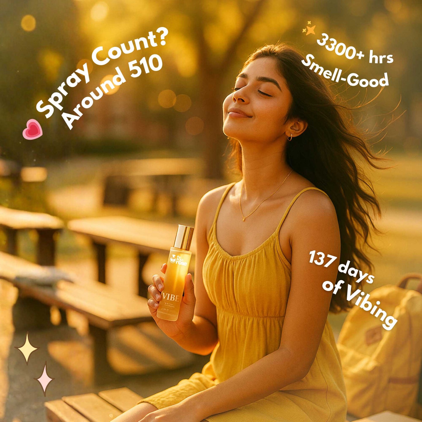 A girl in a yellow dress holding Vibe perfume outdoors with warm golden lighting and text showing spray count and longevity.