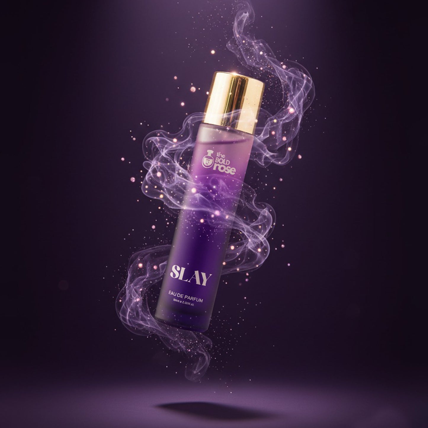 The Bold Rose Slay perfume bottle with purple smoke aura and luxe gold cap on a dark violet background.