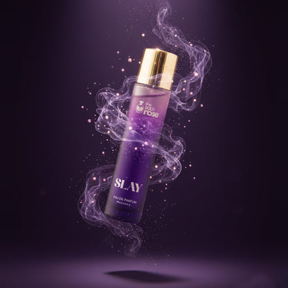 The Bold Rose Slay perfume bottle with purple smoke aura and luxe gold cap on a dark violet background.