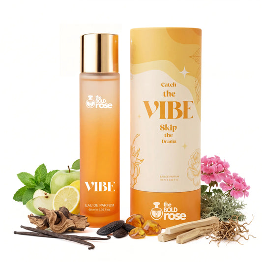 Yellow perfume bottle and cylindrical container with 'VIBE' branding, surrounded by natural elements on a white background.